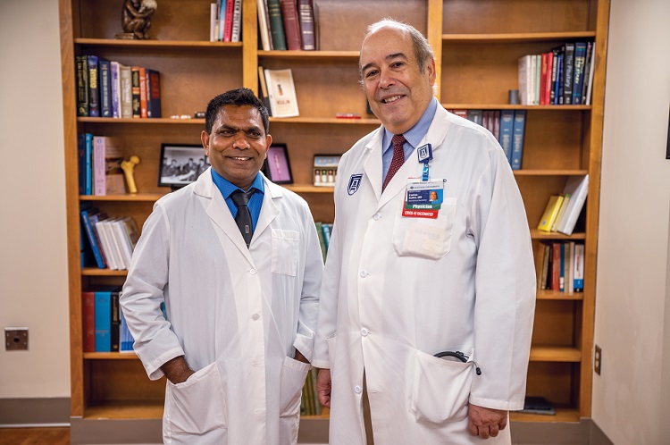Two doctors pose for camera