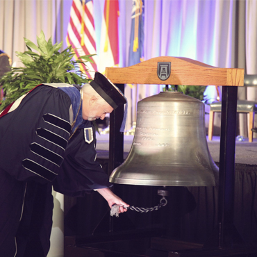 Arsenal bell being rung by president Keel.