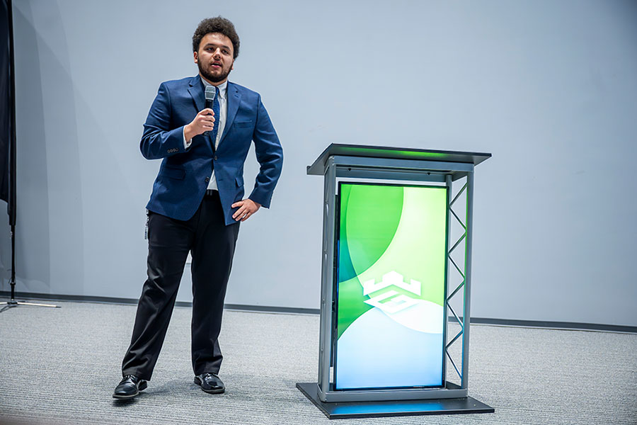 male student pitching during pitch competition