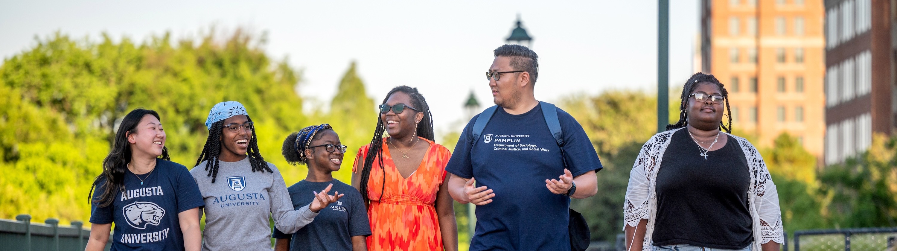students walking and talking at riverfront campus