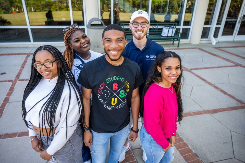 group of students standing together and smiling