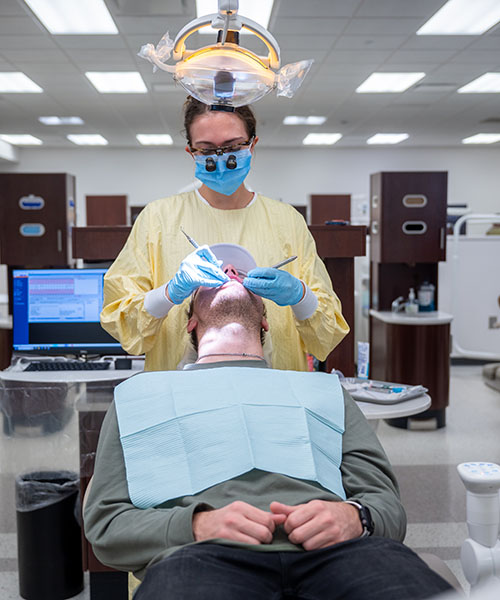 dental student working on someone