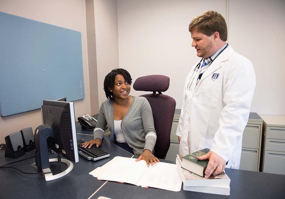 Health Services student with professor