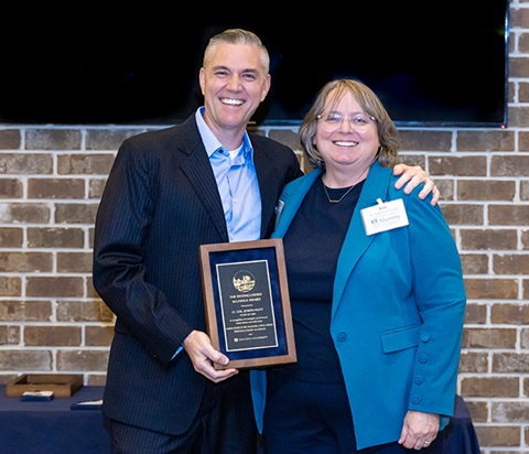 John Huitt accepting Distinguished Alumni award