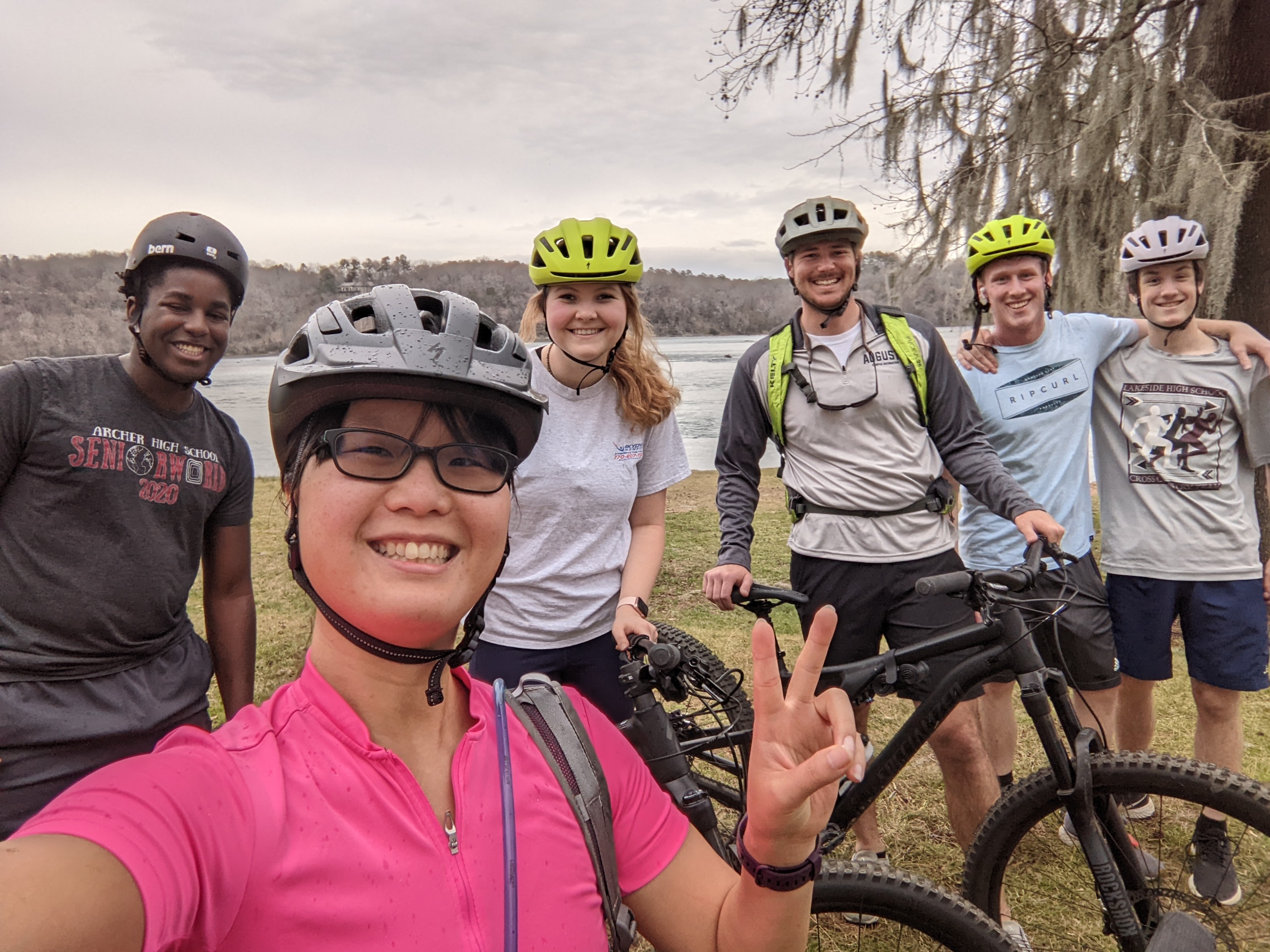 student group taking selfie with bikes