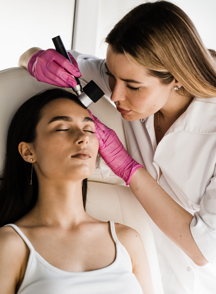 woman gets a mark on her skin looked at