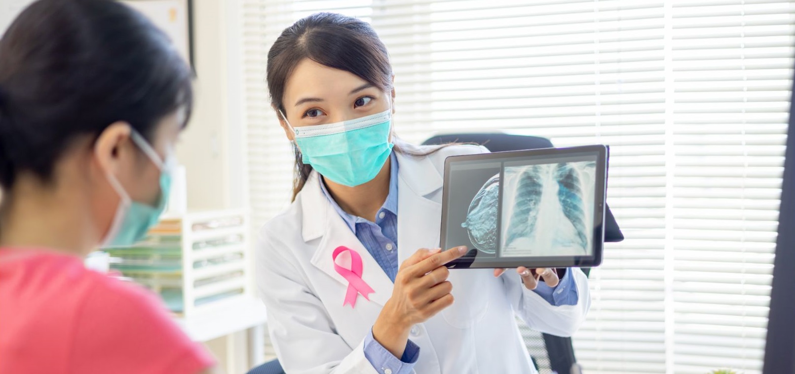 female doctor talks to patient about her mammogram results