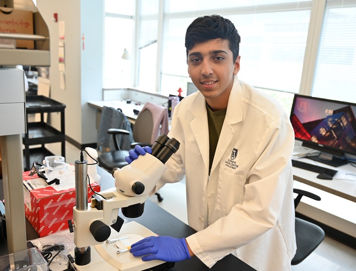 Patel poses with microscope Patel poses with microscope