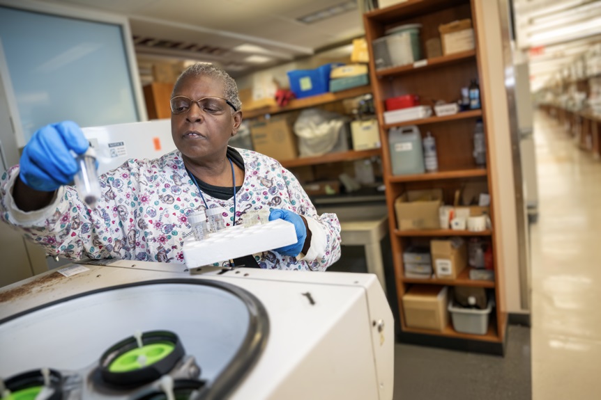 Dr. Munn's team member working in lab.