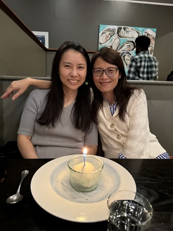 two women smiling and looking at the camera