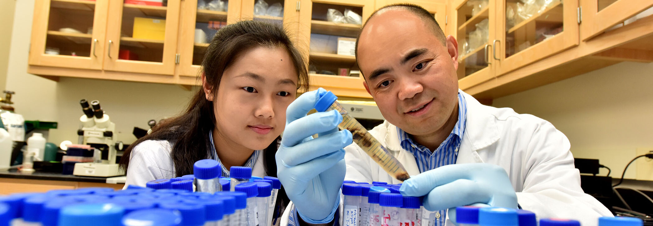 VBC Dr. Tang working with a Student in the lab