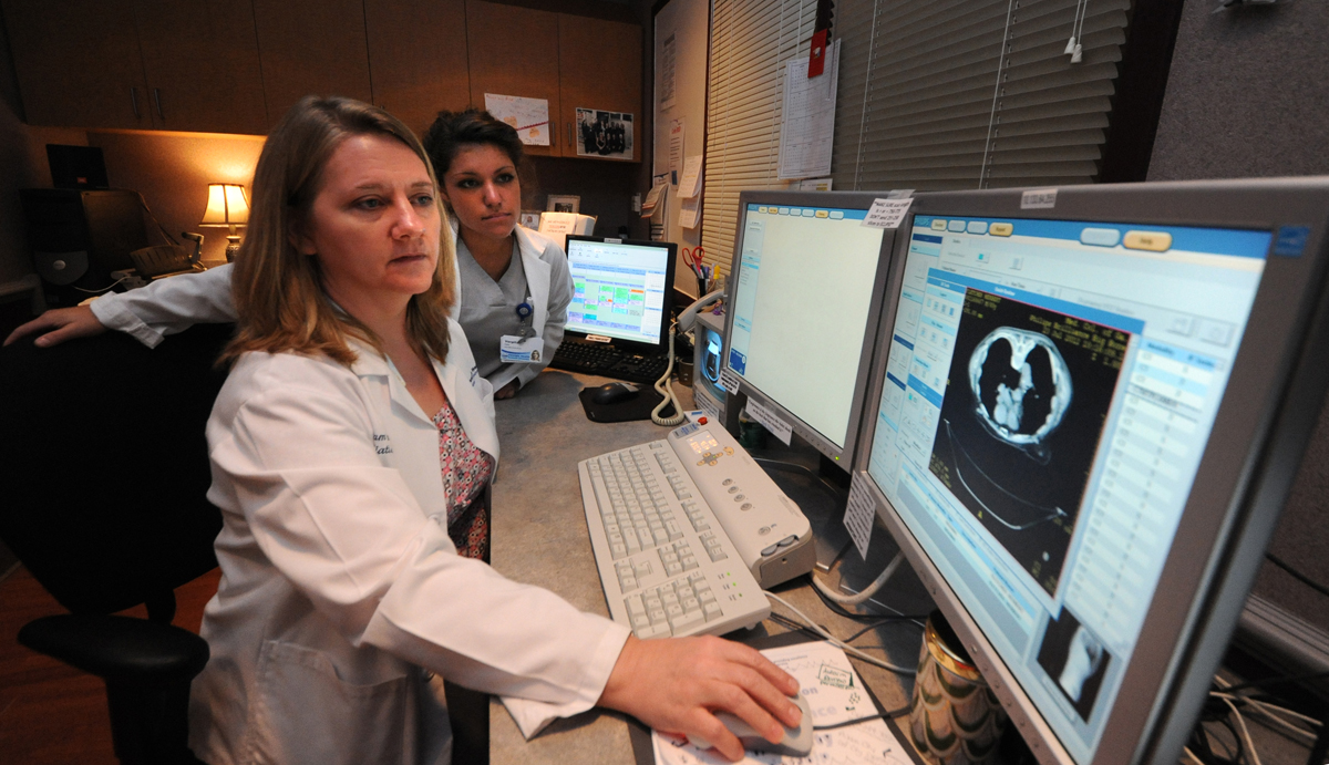 Radiation Therapy students look at scans