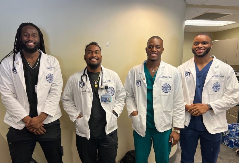 4 students smiling for a photo