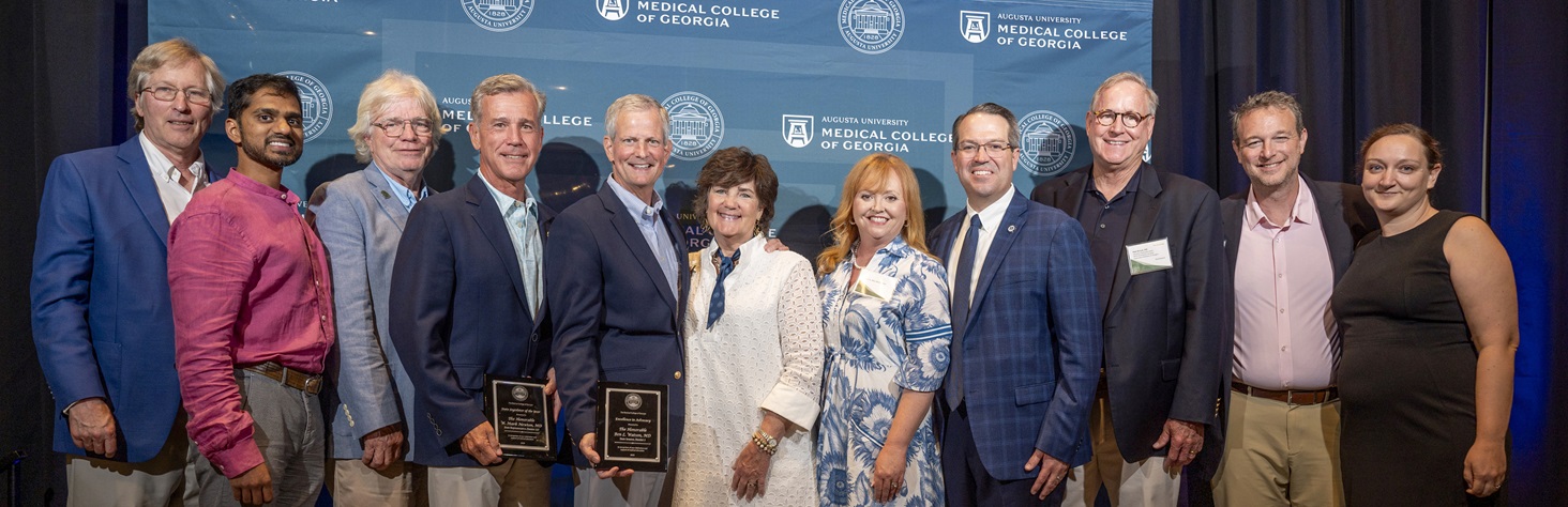 MCG logo and green background