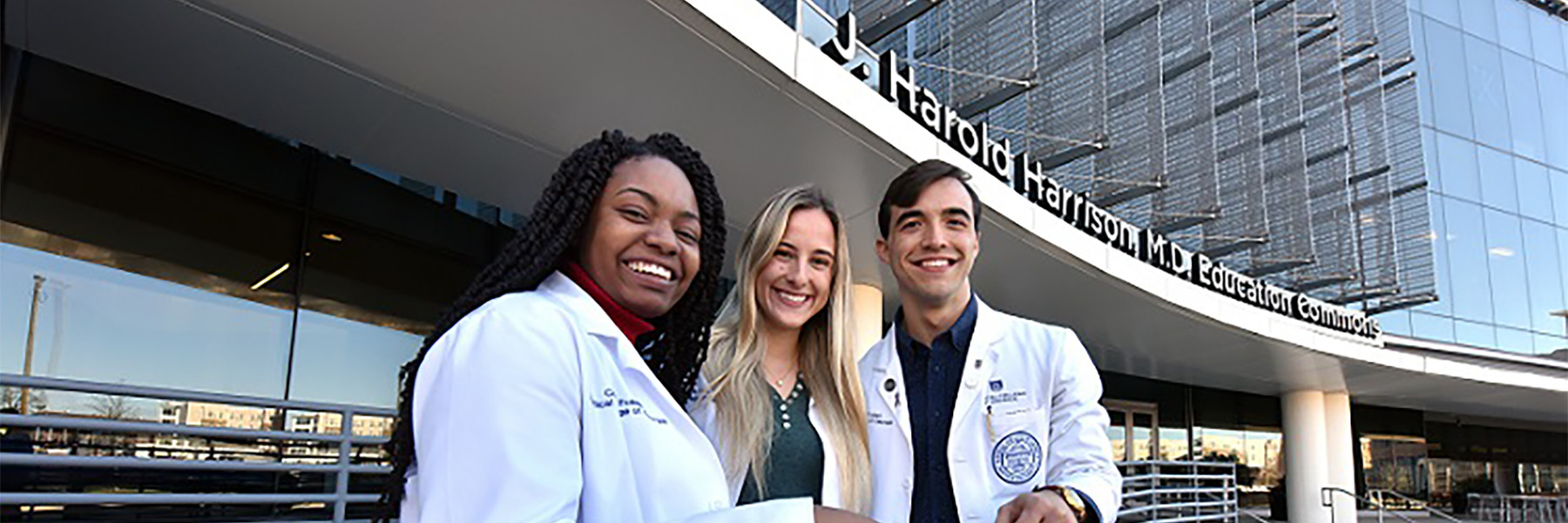 MCG students sitting eating outside Harrison Commons