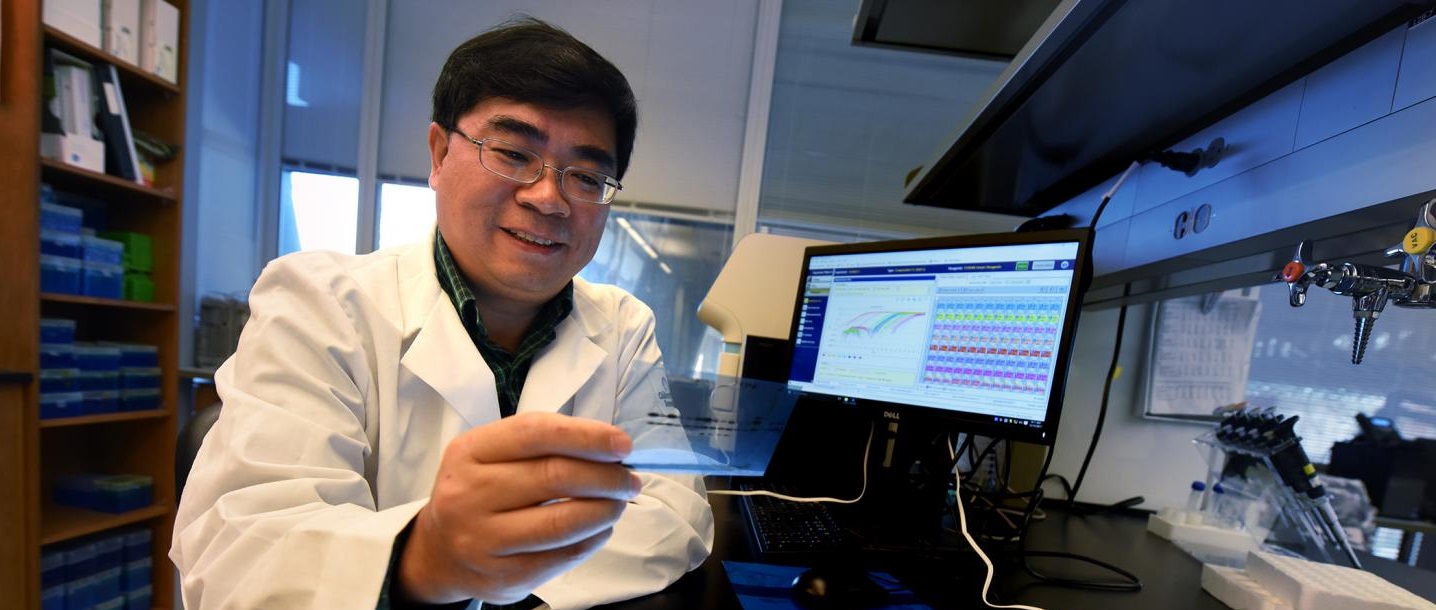 Dr. Honglin li poses in his lab