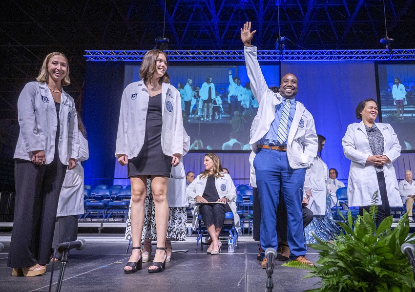 Group of young adults posing for camera at White Coat Class of 2027