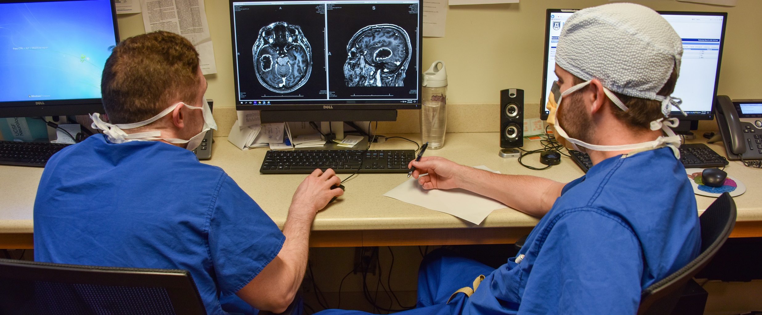 doctors looking at scan of brain