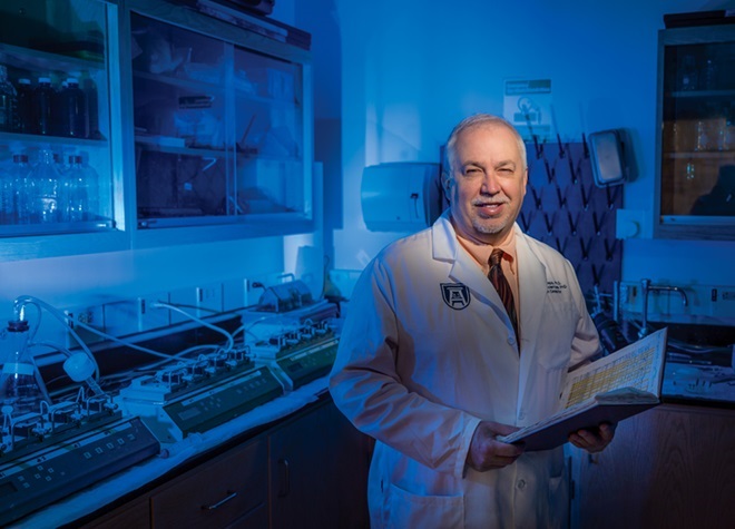 David Stepp poses in his lab