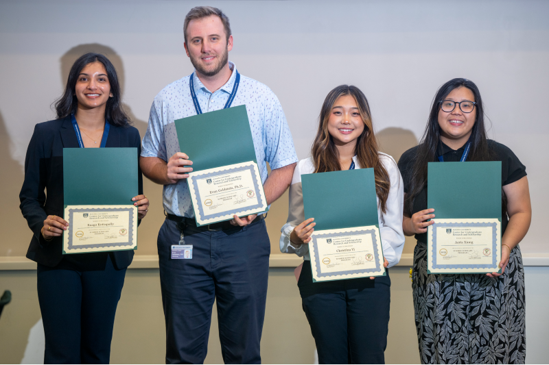 man and three women standing holding certificates