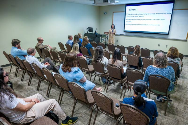 student presenting to group