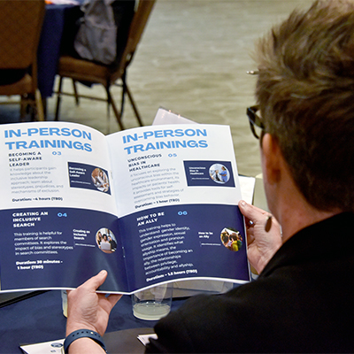 Dr. Linville looking at the EPO Training Opportunities Catalog