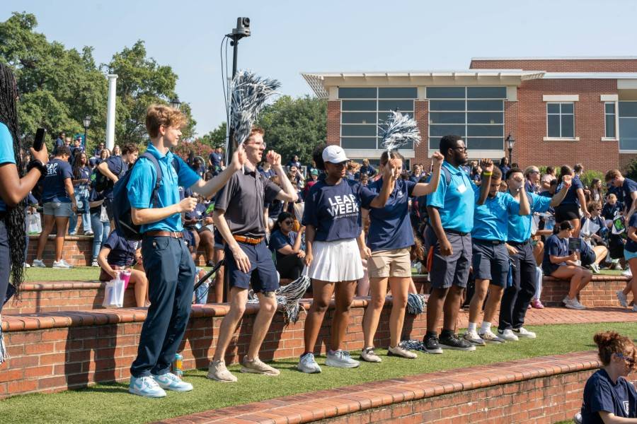 students dancing in outdoor amphitheater