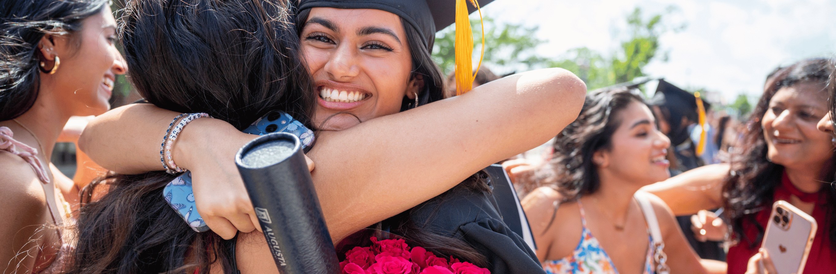 grateful graduate hugs