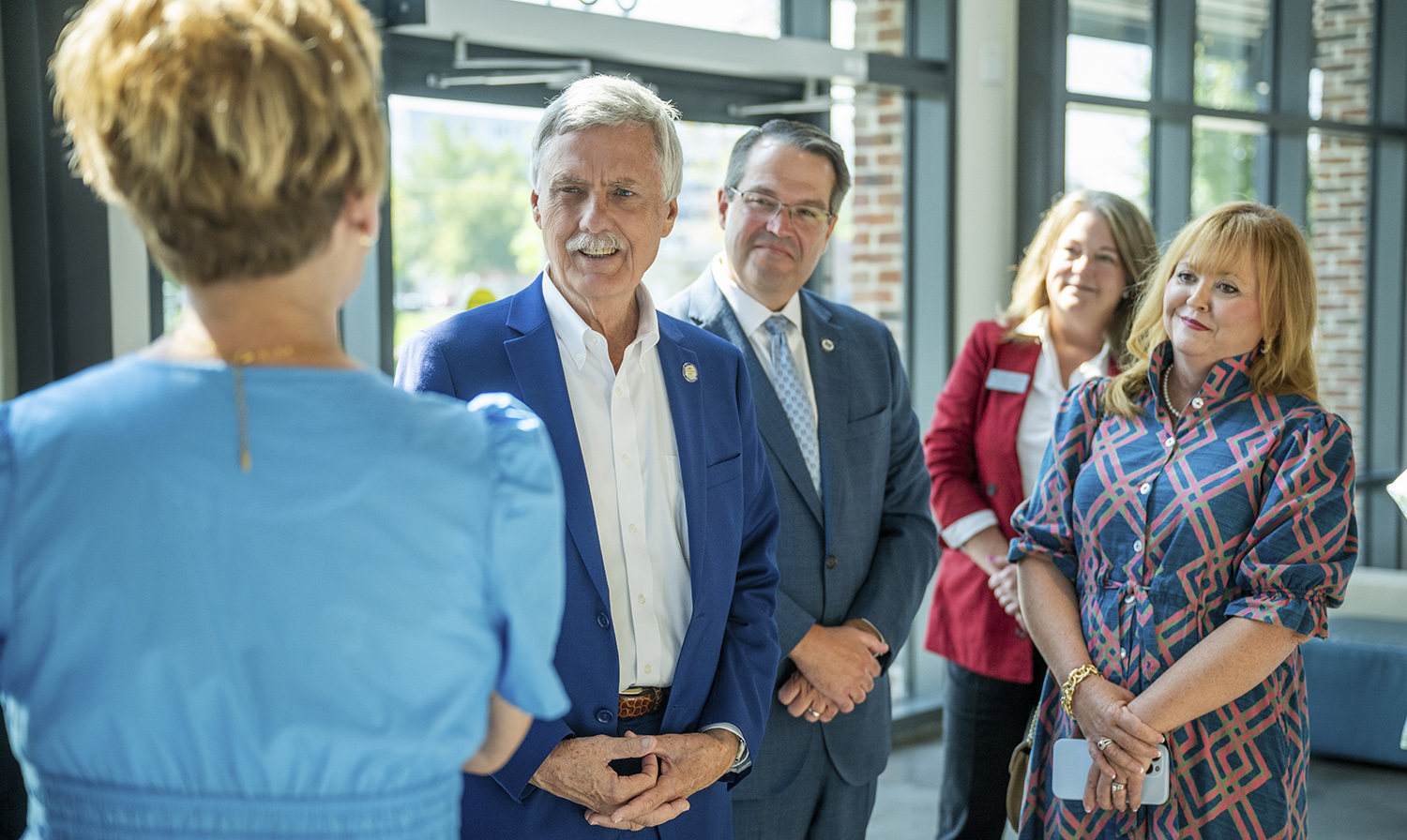 President Russell T Keen and First Lady Karen Keen standing with Senator Billy Hickman