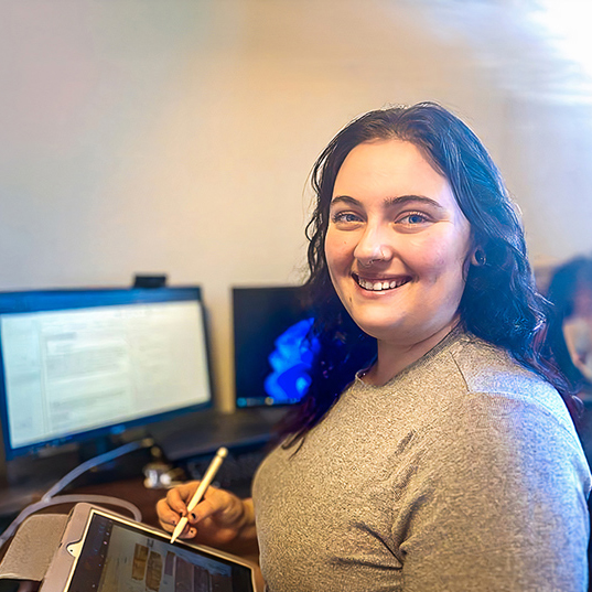 Alexis Williams at desk