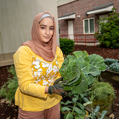 Student holding veggies