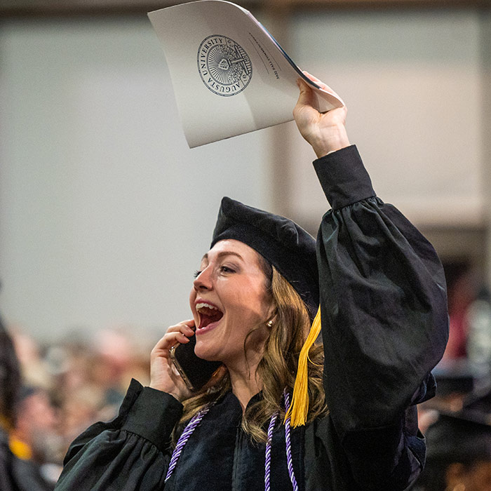 Student celebrating at Commencement