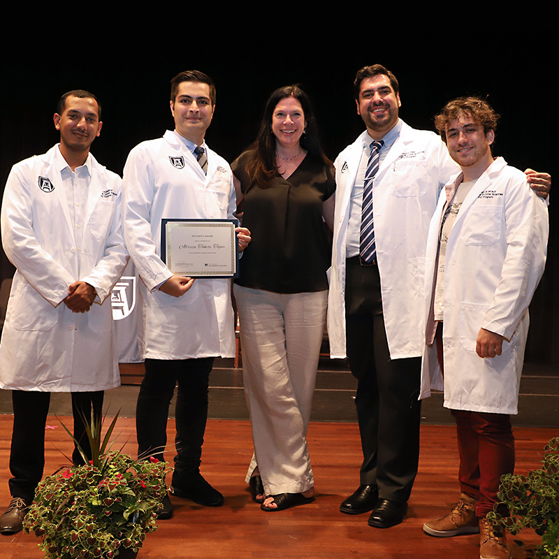 Dr. Sullivan with white coat recipients