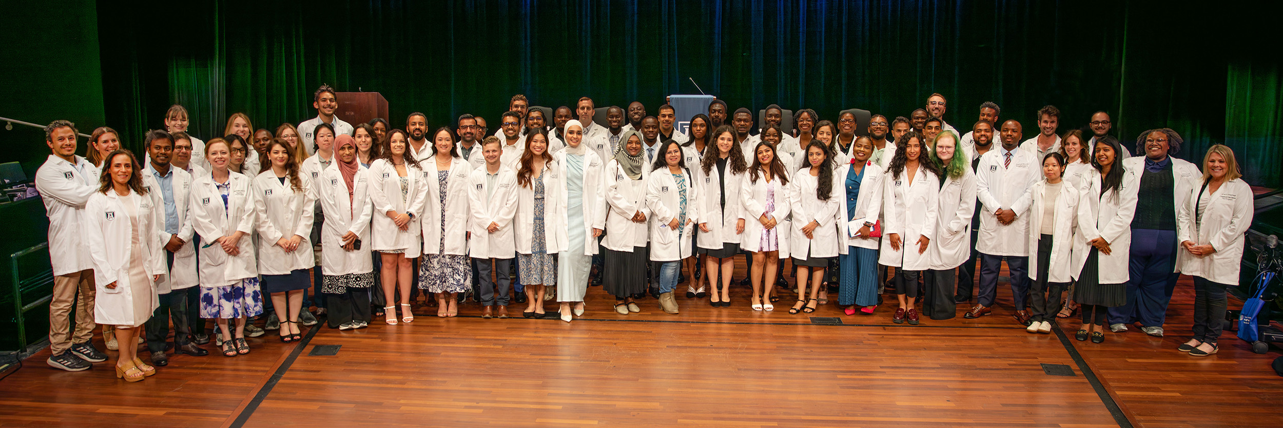 students in their white coats