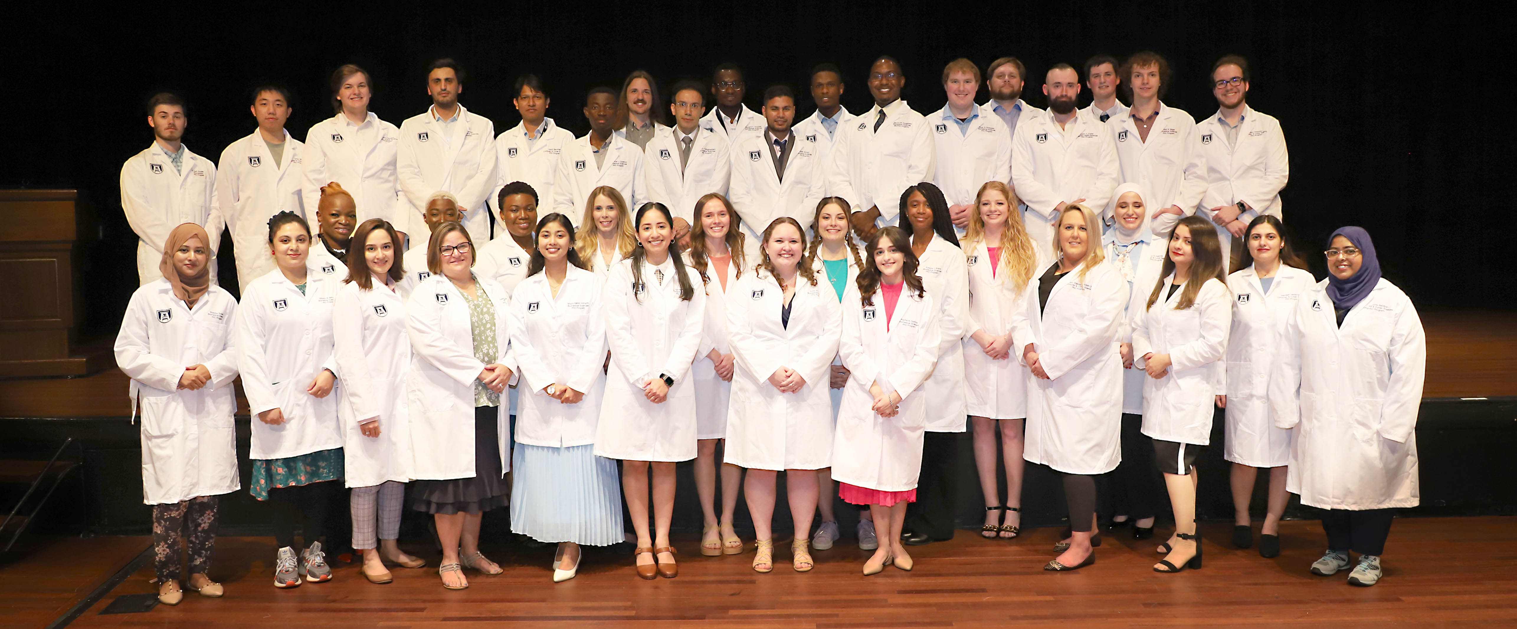 students in their white coats