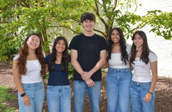 HPSA Exec 2025-2026 four women and one man standing together in front of a tree