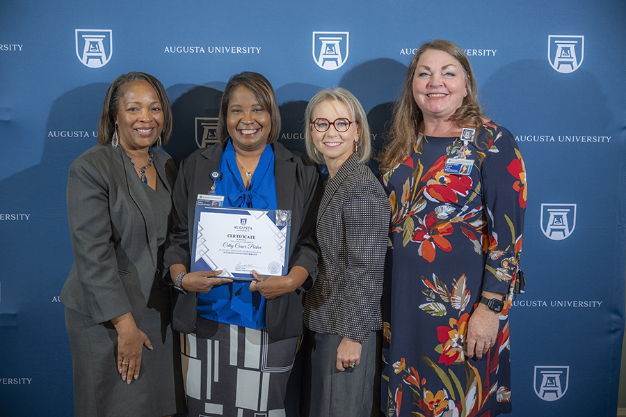 Three AU employees at 2024 ceremony