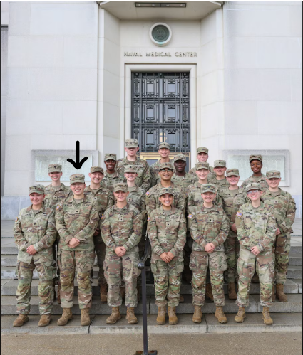 group of people in military uniform standing on steps