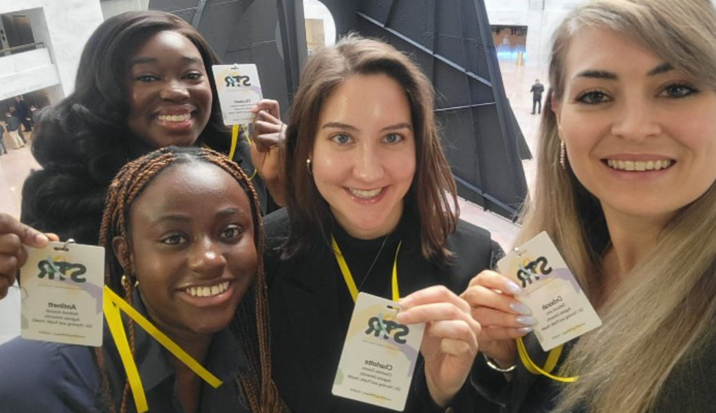 Group photo of women with charlotte downs in the middle