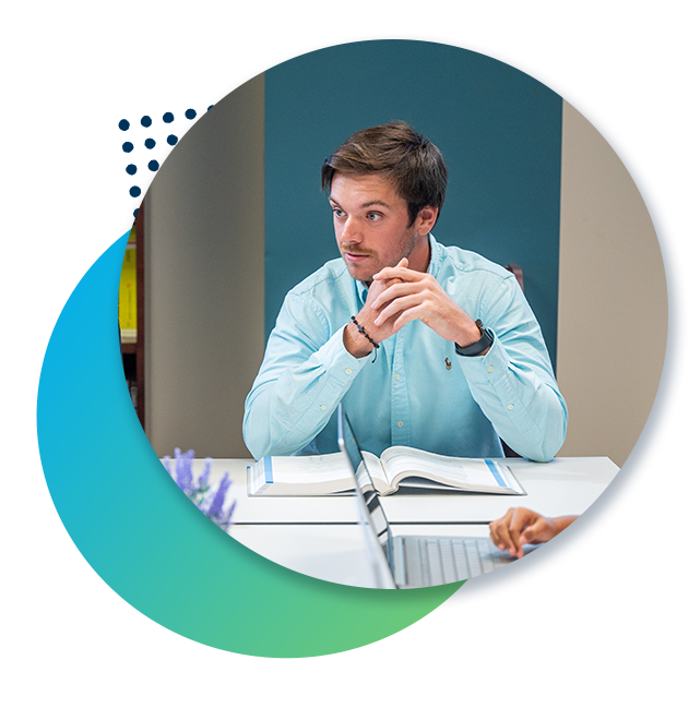 A business graduate student leads a meeting