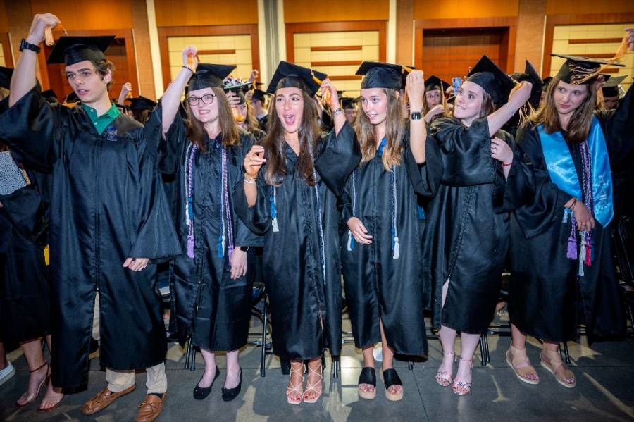students turning tassels at graduation