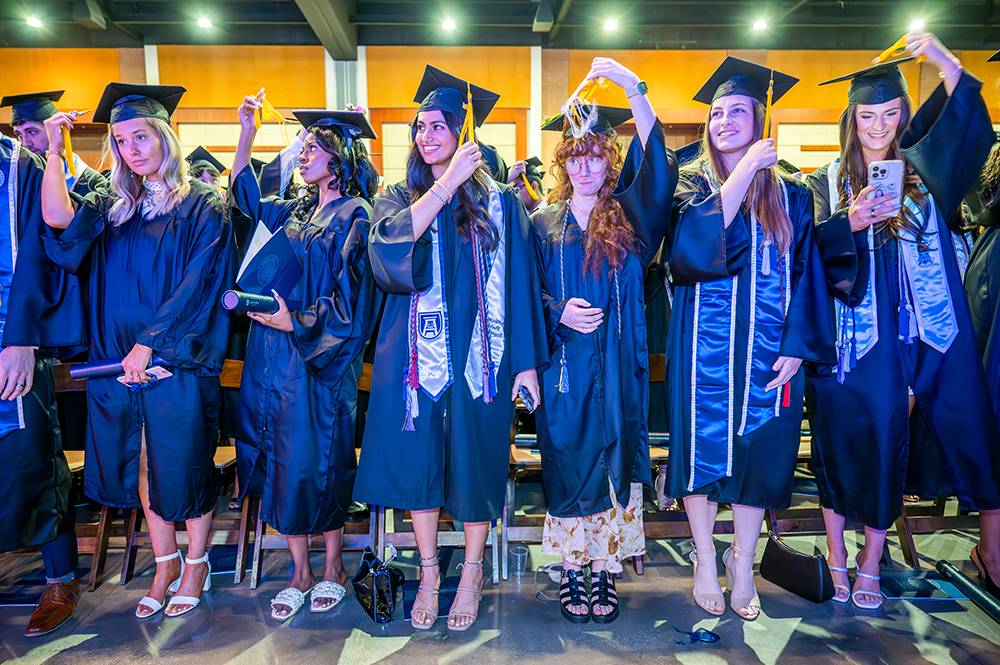 students turning tassels at graduation