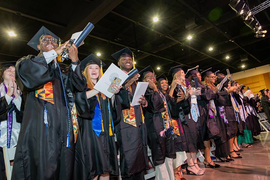 students turning tassels at graduation