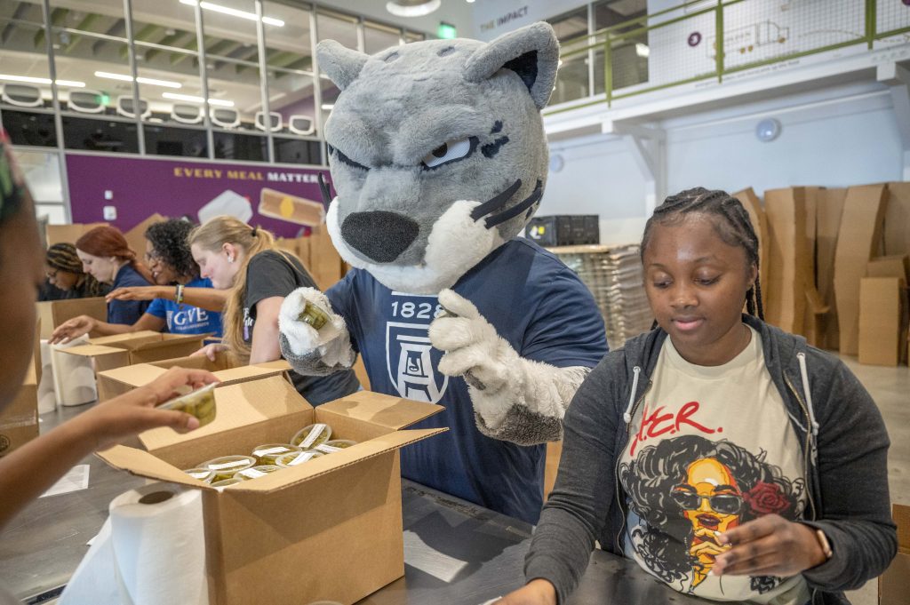 Augustus and Student packaging food