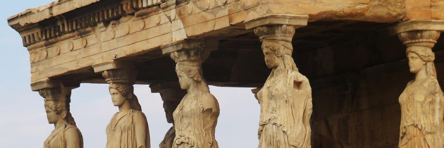 A close-up view of the Parthenon in Athens, Greece, showing columns shaped into statues of humans