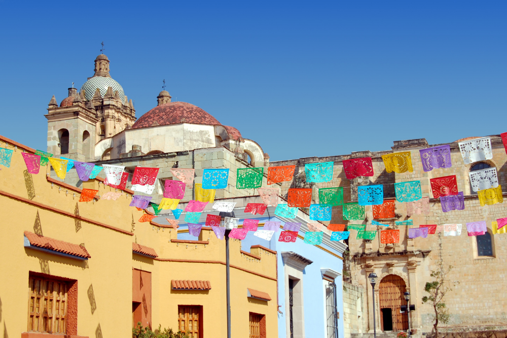 colorful flags above old buildings